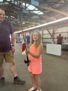 winner of kid’s raffle for fish pole at Acton Fair